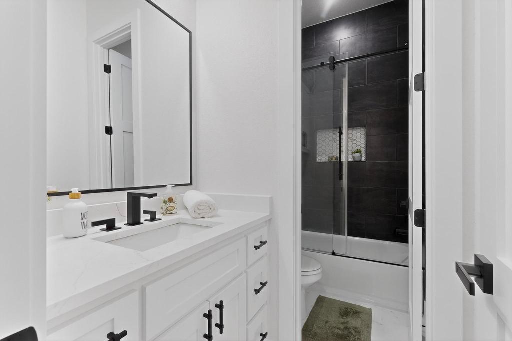 9100 County Road 669 Blue Ridge, TX 75424 - Photo 23 of 40 a bathroom with a sink and a mirror
