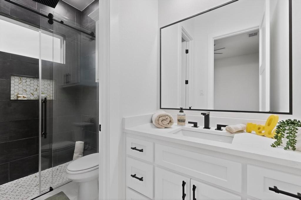 9100 County Road 669 Blue Ridge, TX 75424 - Photo 26 of 40 a bathroom with a sink toilet and shower