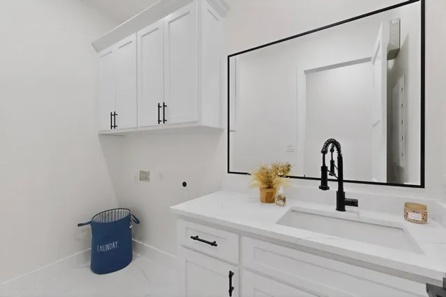 a bathroom with a sink and a shower