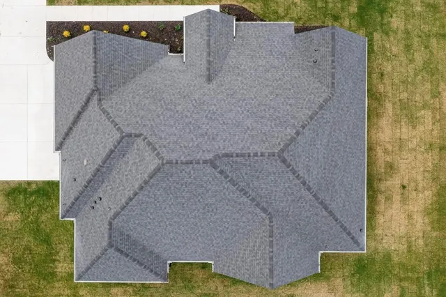 a bathroom with a shower and mirror