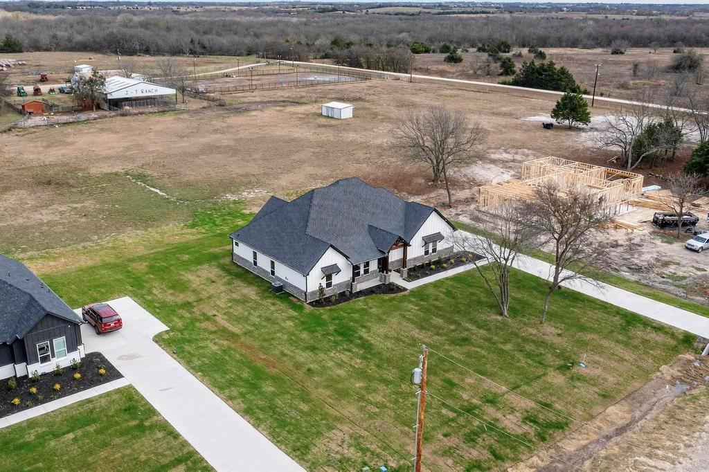 9100 County Road 669 Blue Ridge, TX 75424 - Photo 31 of 40 a front view of a house with garden