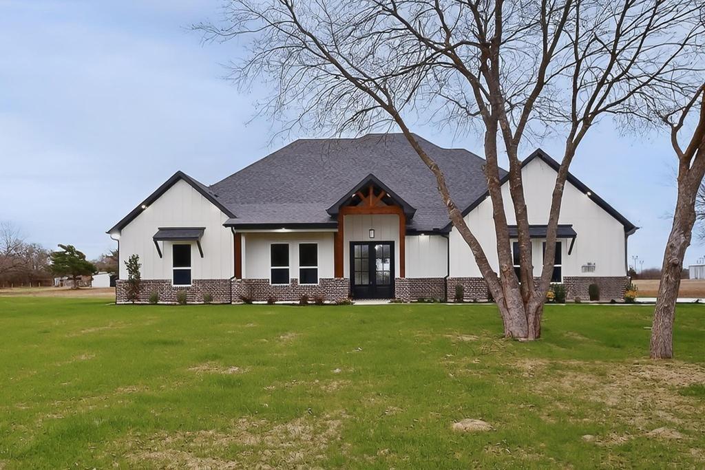 9100 County Road 669 Blue Ridge, TX 75424 - Photo 5 of 40 a white house with a big yard and large trees