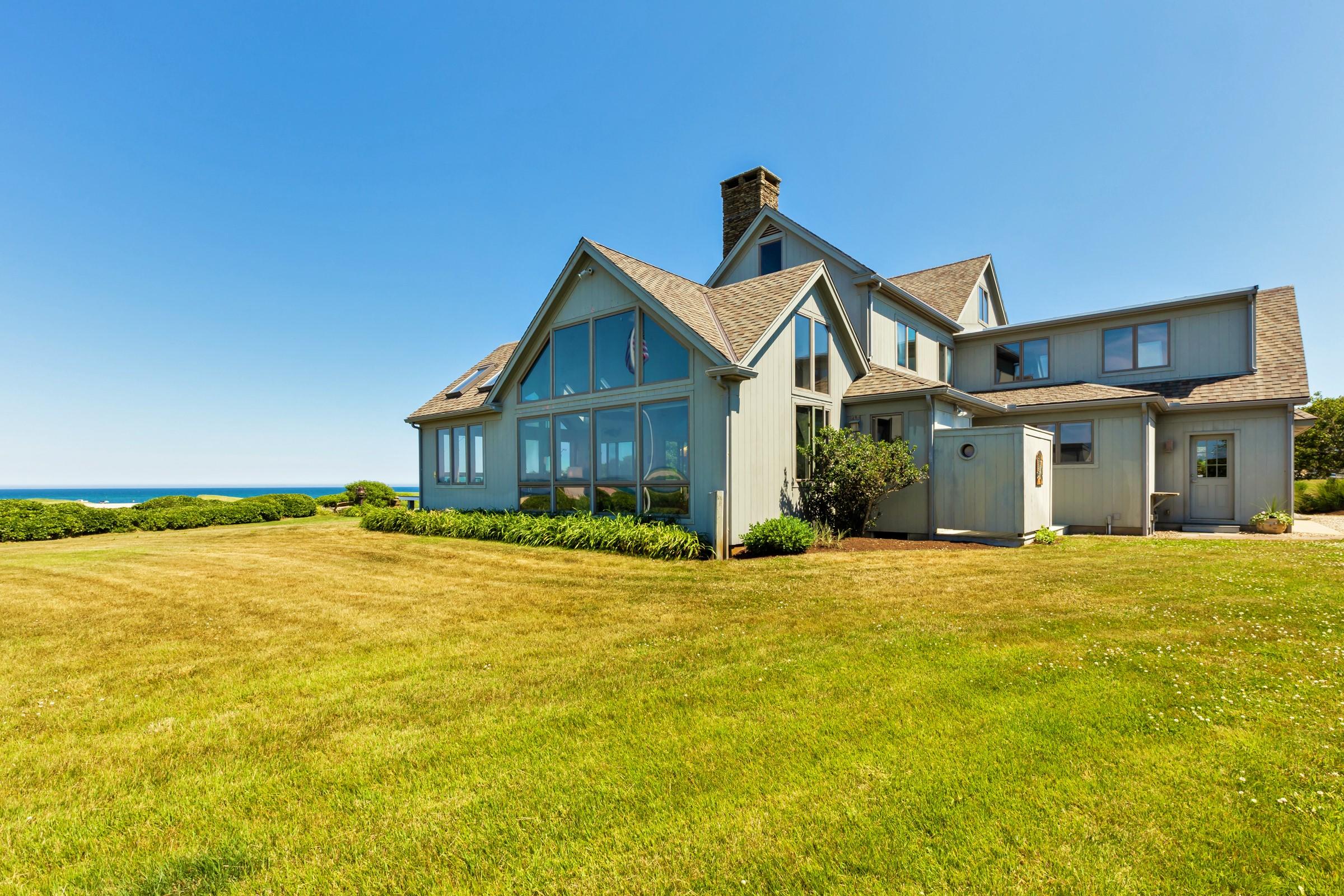 2-7 Skunk Bluff Orleans, MA 02653 - Photo 13 of 80 a front view of a house with yard and balcony