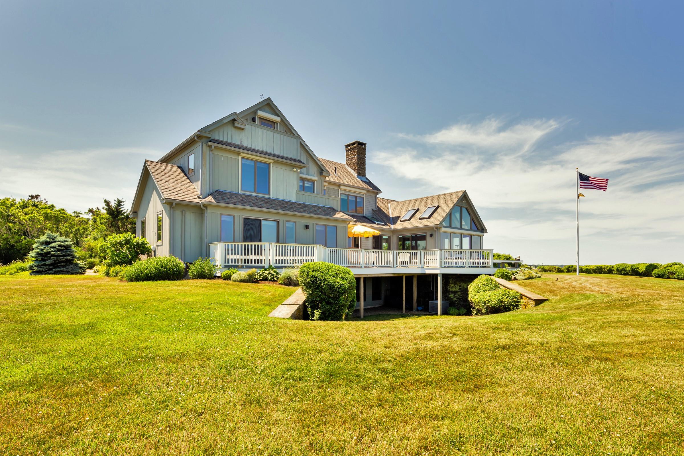 2-7 Skunk Bluff Orleans, MA 02653 - Photo 14 of 80 a front view of a house with a yard
