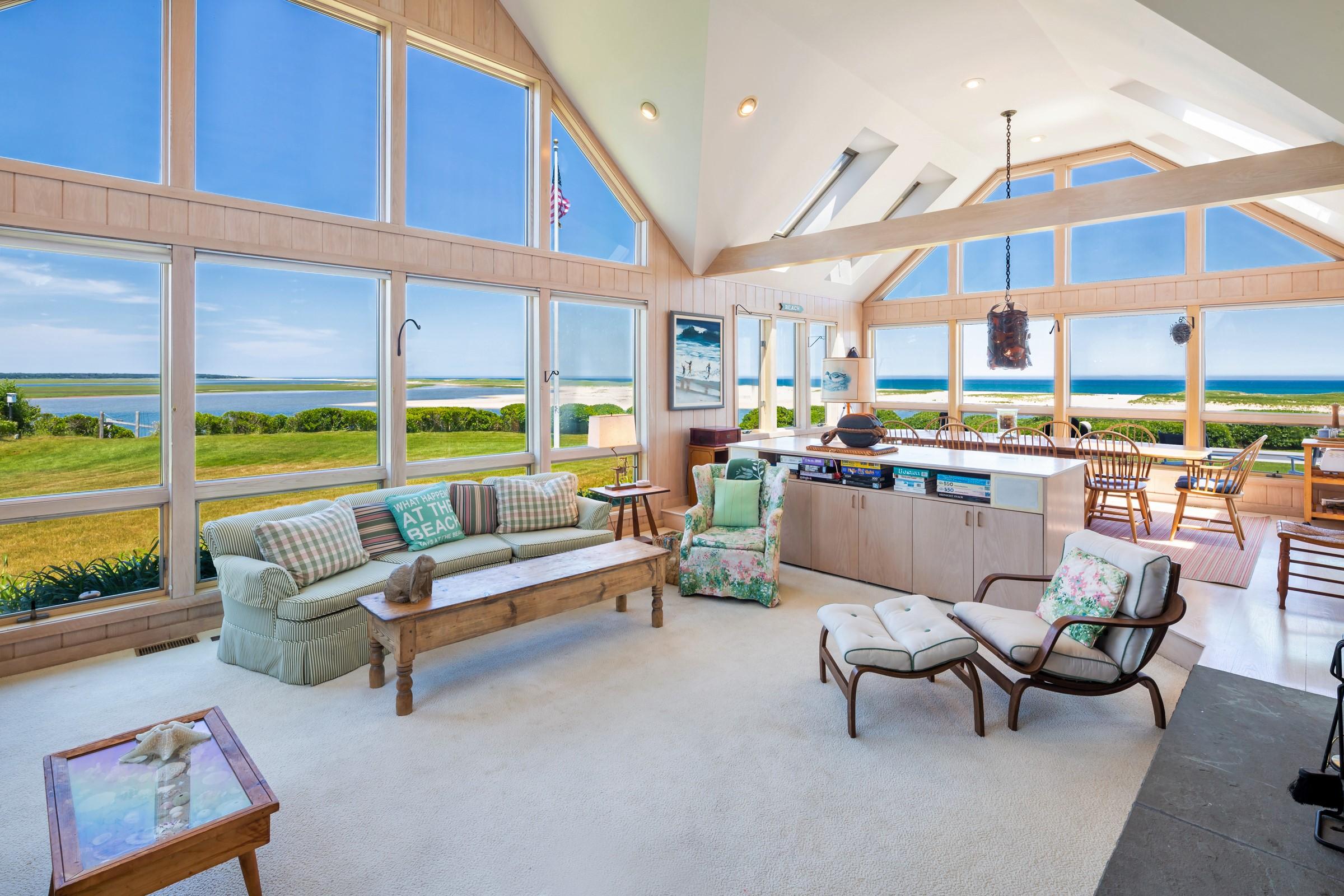 2-7 Skunk Bluff Orleans, MA 02653 - Photo 20 of 80 a living room with furniture and a floor to ceiling window