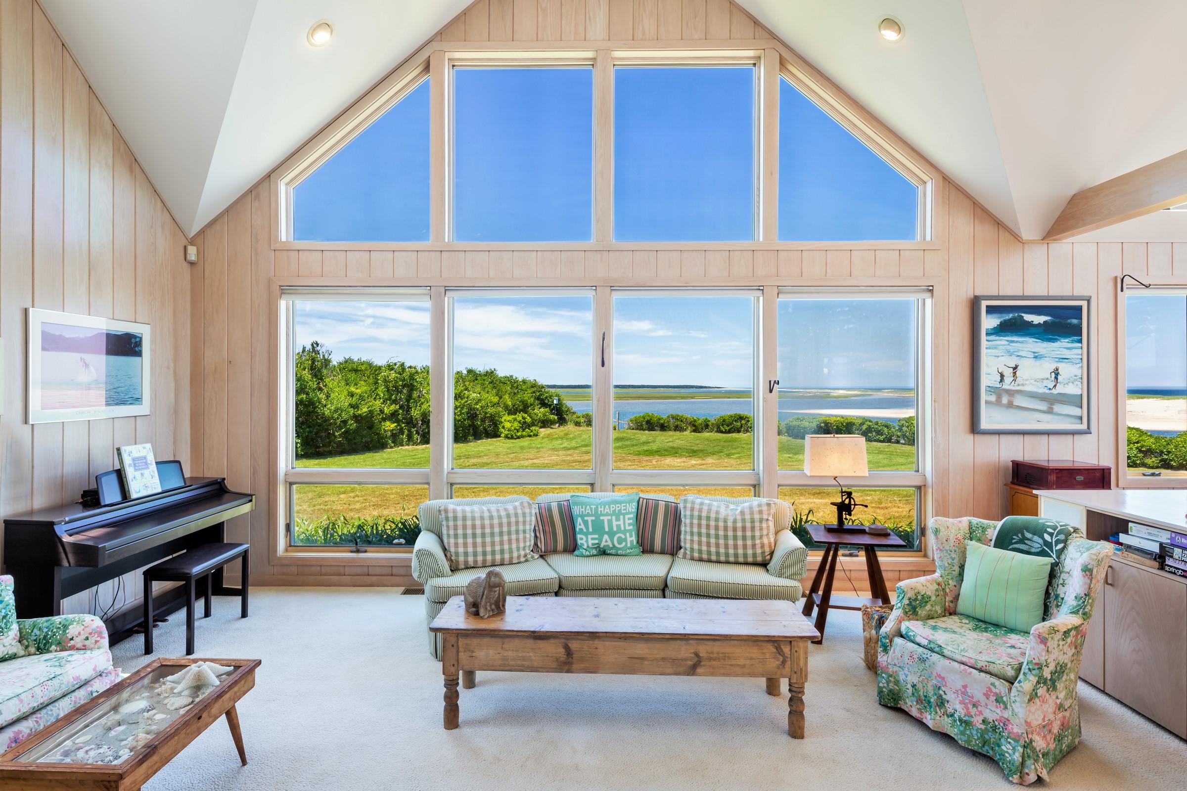 2-7 Skunk Bluff Orleans, MA 02653 - Photo 21 of 80 a living room with furniture and a large window