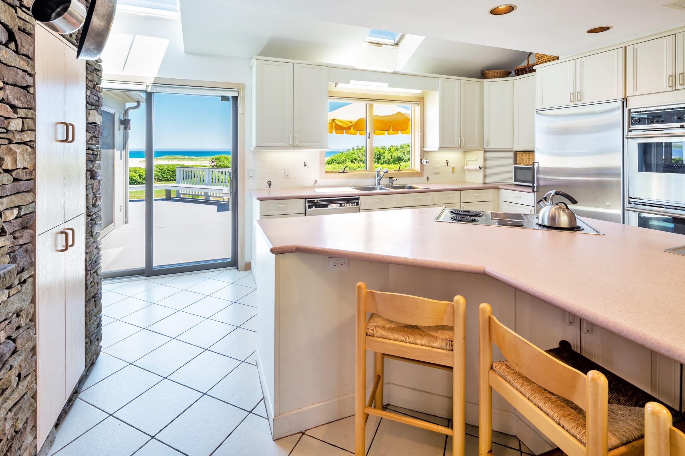 2-7 Skunk Bluff Orleans, MA 02653 - Photo 24 of 80 a kitchen with a sink cabinets and window