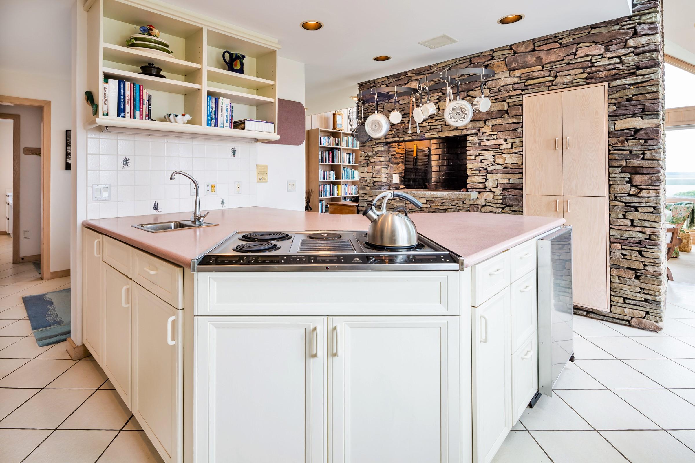 2-7 Skunk Bluff Orleans, MA 02653 - Photo 26 of 80 a kitchen with stainless steel appliances granite countertop a sink and cabinets