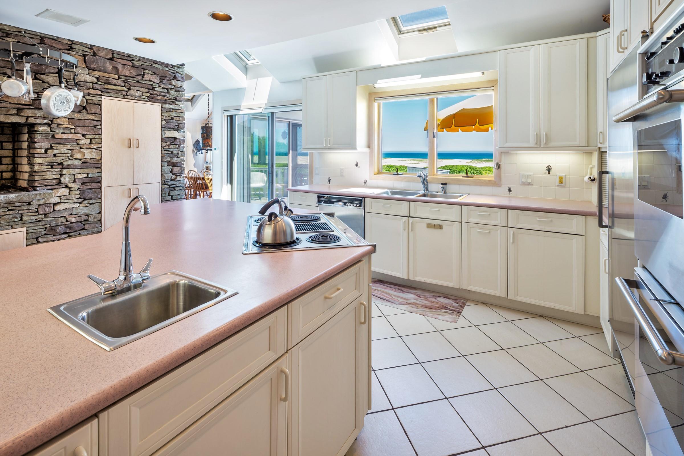 2-7 Skunk Bluff Orleans, MA 02653 - Photo 27 of 80 a kitchen with a sink cabinets and window