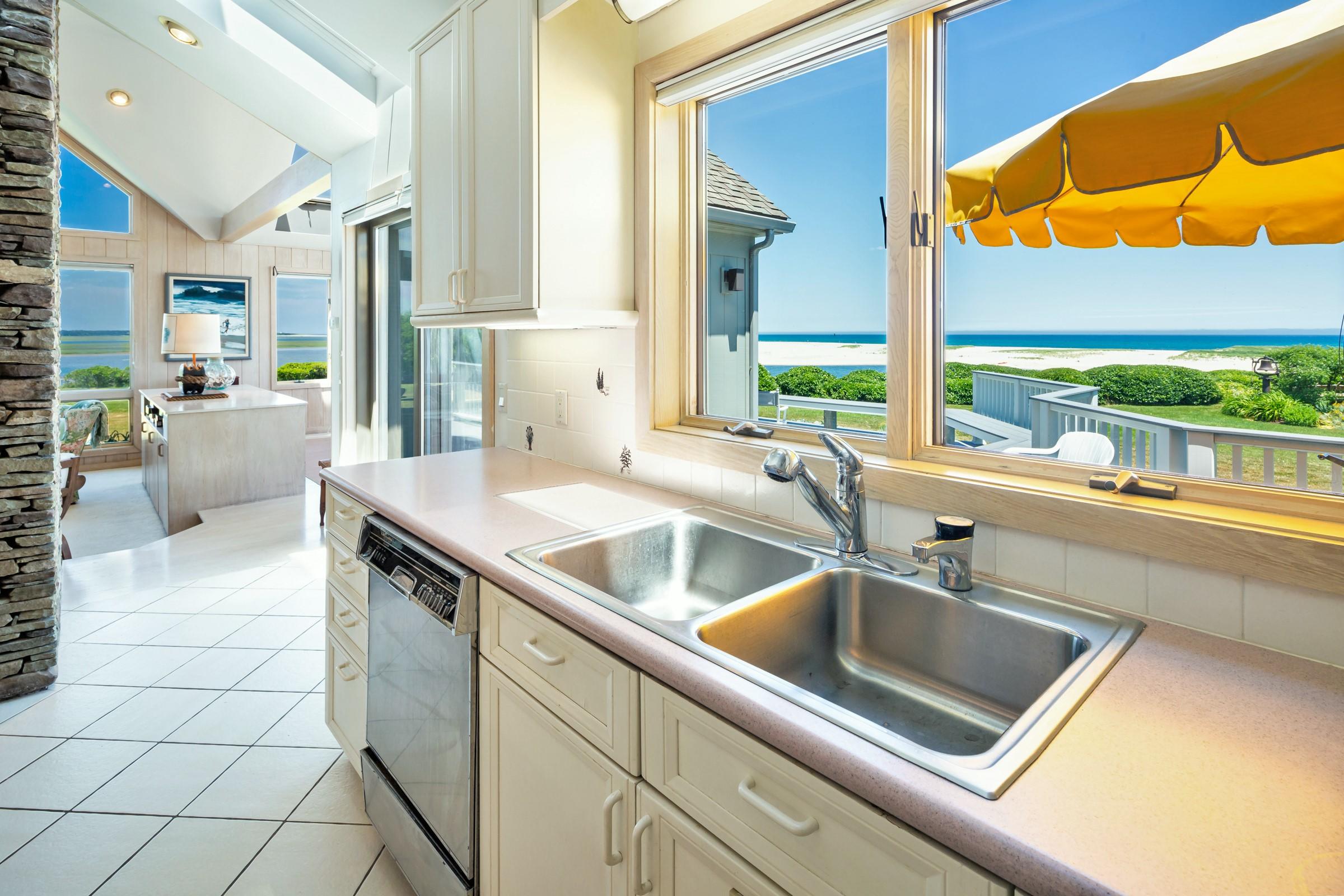 2-7 Skunk Bluff Orleans, MA 02653 - Photo 28 of 80 a kitchen with a sink and a counter top space