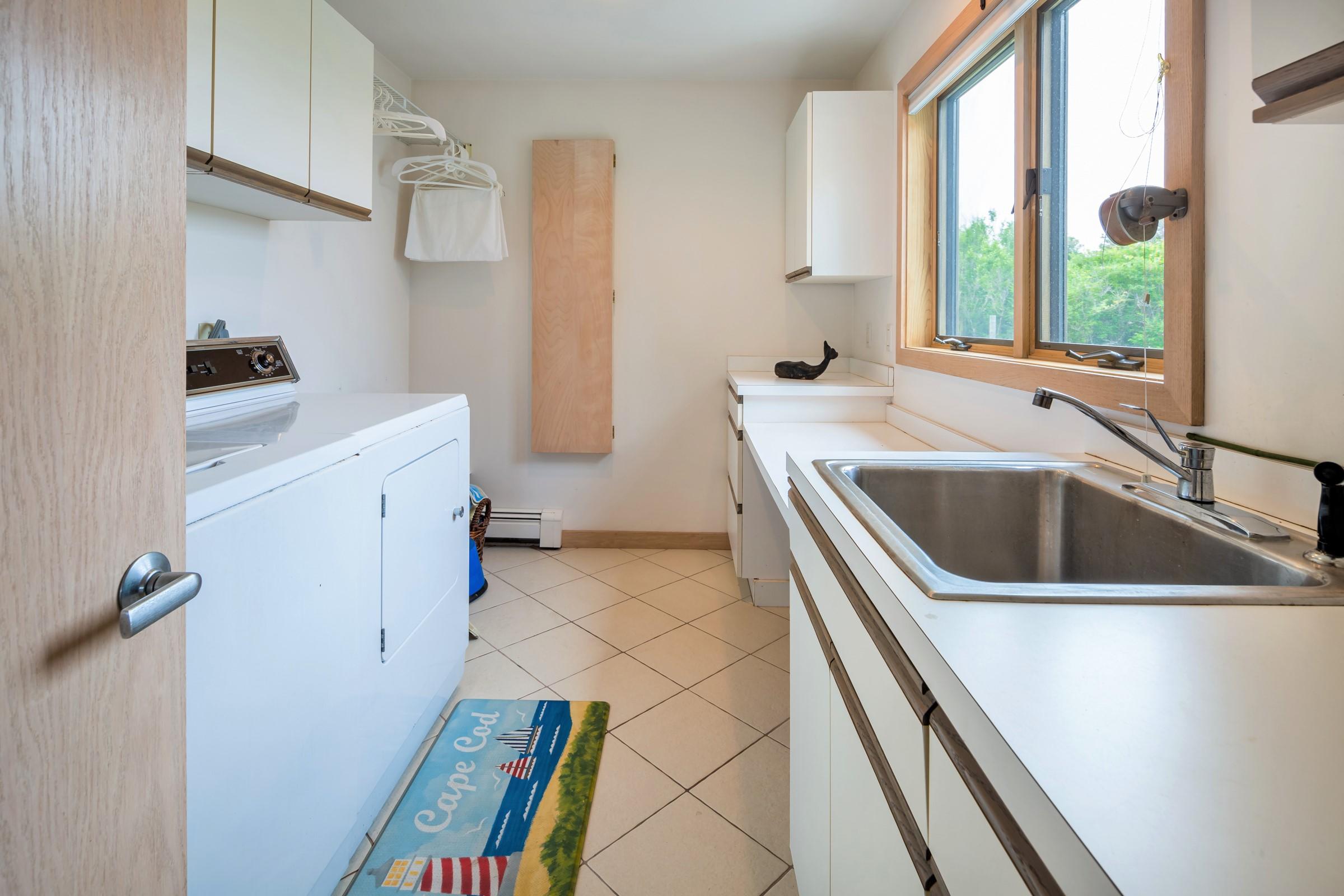 2-7 Skunk Bluff Orleans, MA 02653 - Photo 30 of 80 a view of a kitchen with a sink and dishwasher