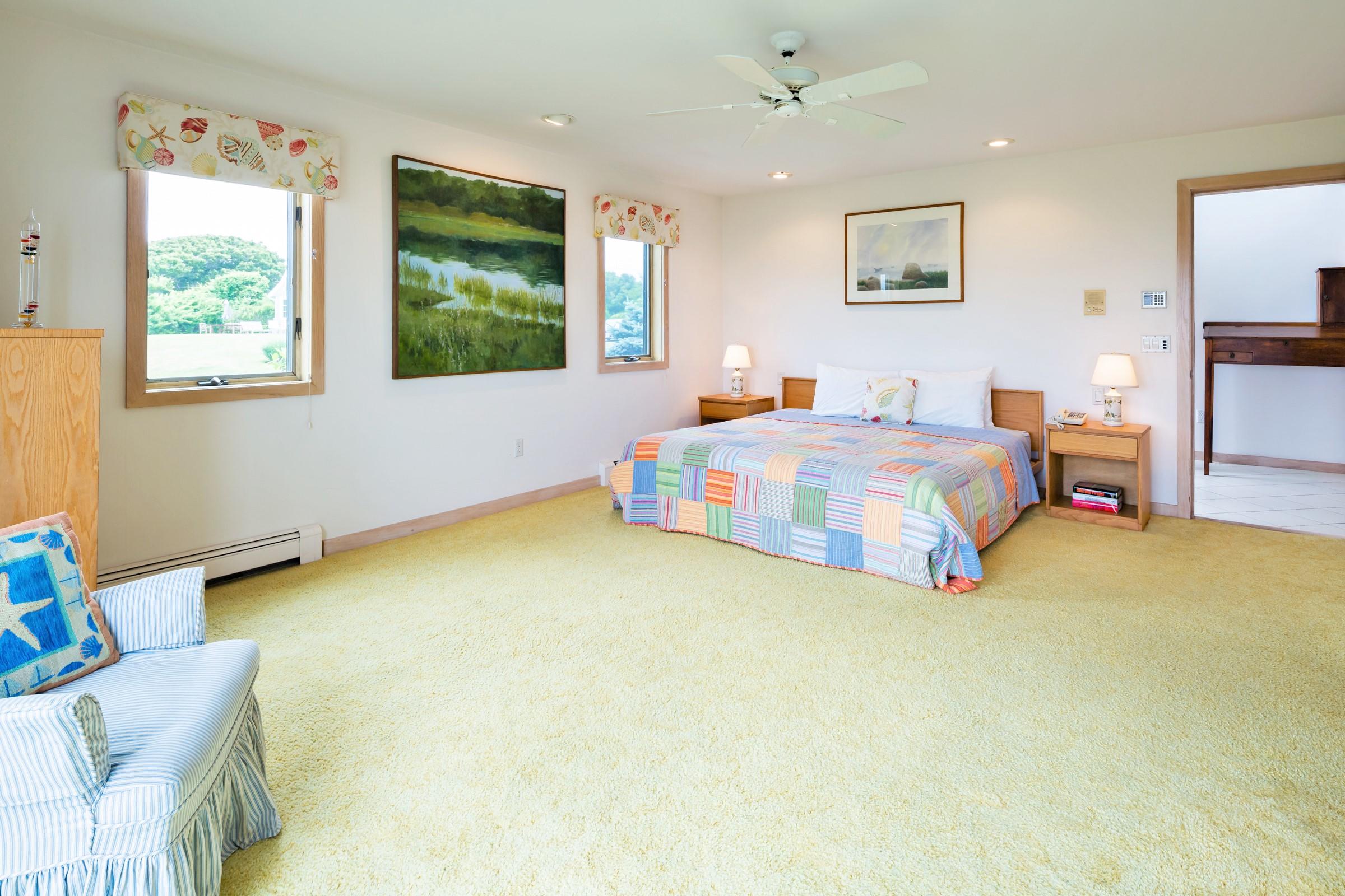 2-7 Skunk Bluff Orleans, MA 02653 - Photo 31 of 80 a spacious bedroom with a bed and a cabinets