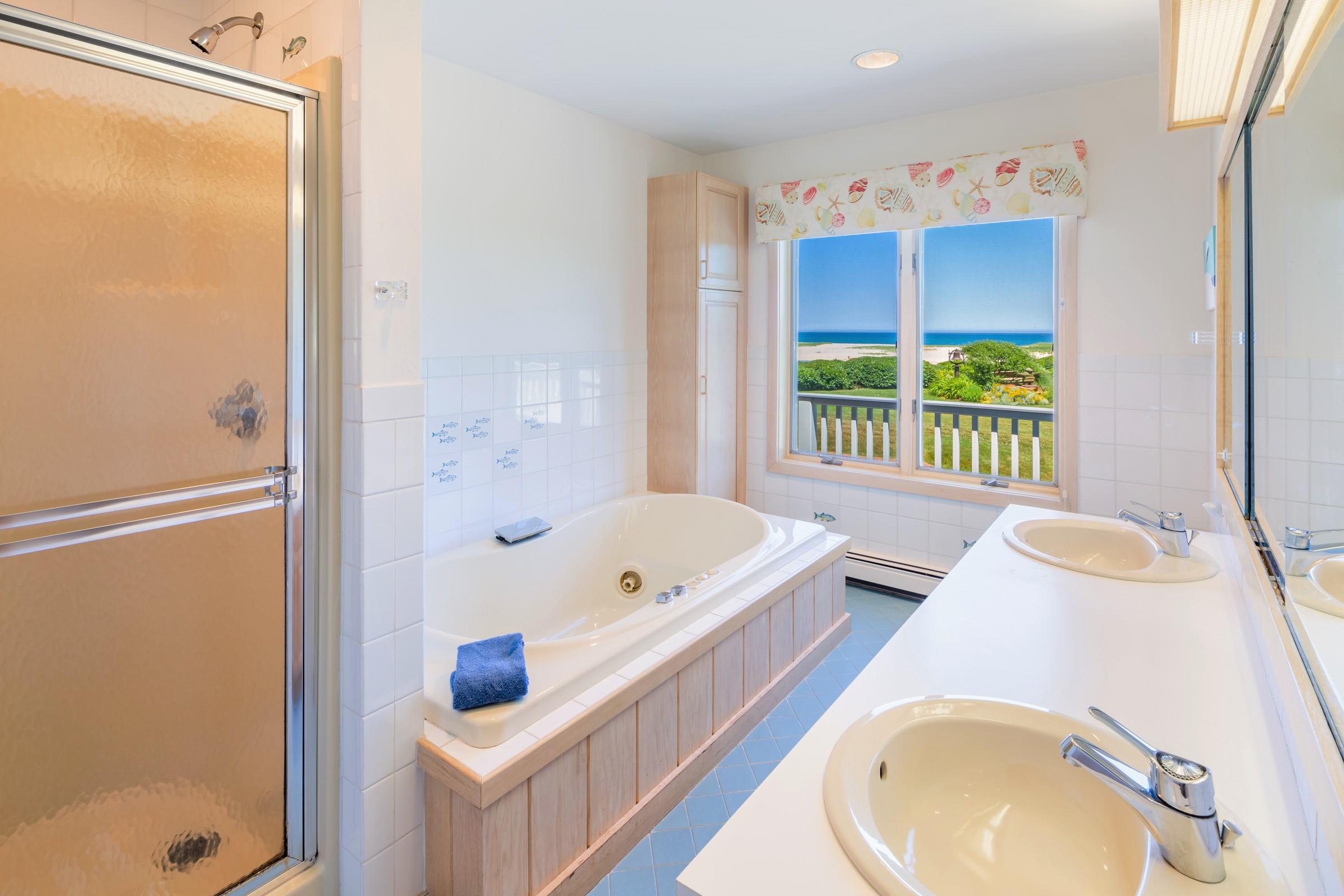 2-7 Skunk Bluff Orleans, MA 02653 - Photo 33 of 80 a bathroom with a tub a sink and a shower