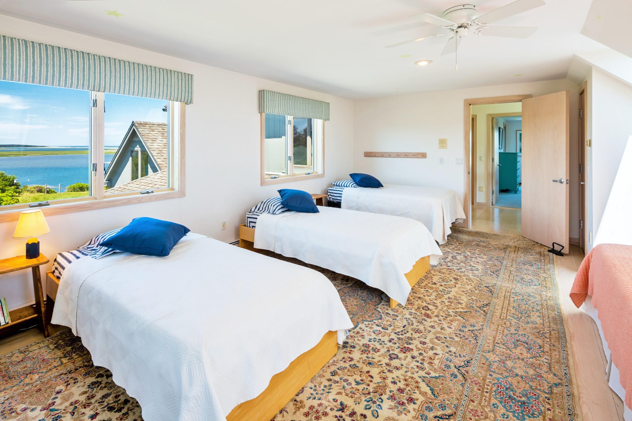 2-7 Skunk Bluff Orleans, MA 02653 - Photo 36 of 80 a bedroom with two beds and painting on the wall