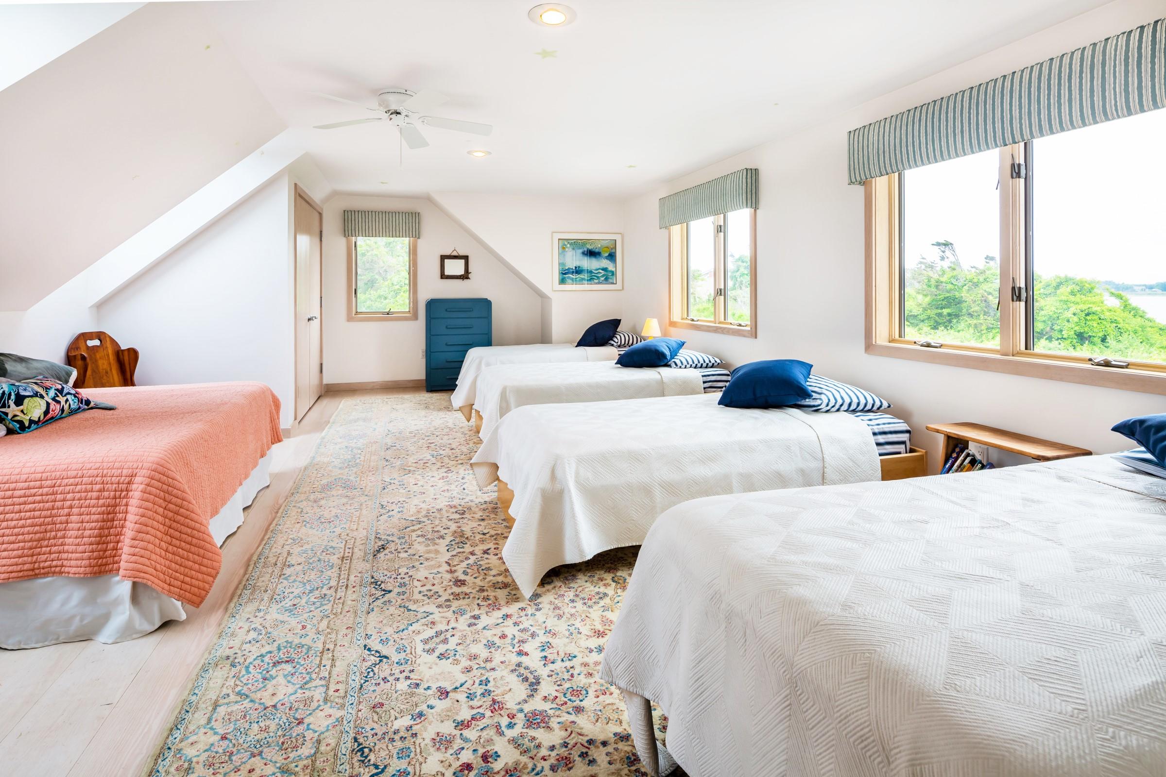 2-7 Skunk Bluff Orleans, MA 02653 - Photo 37 of 80 a bedroom with two beds and a large window