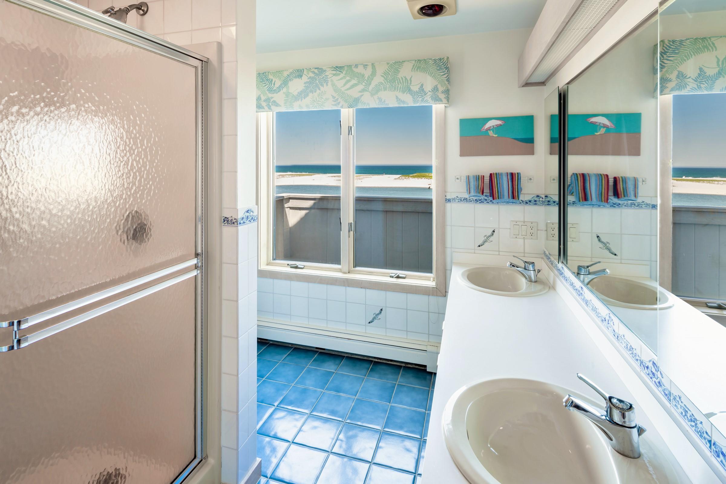 2-7 Skunk Bluff Orleans, MA 02653 - Photo 39 of 80 a bathroom with a sink and mirror