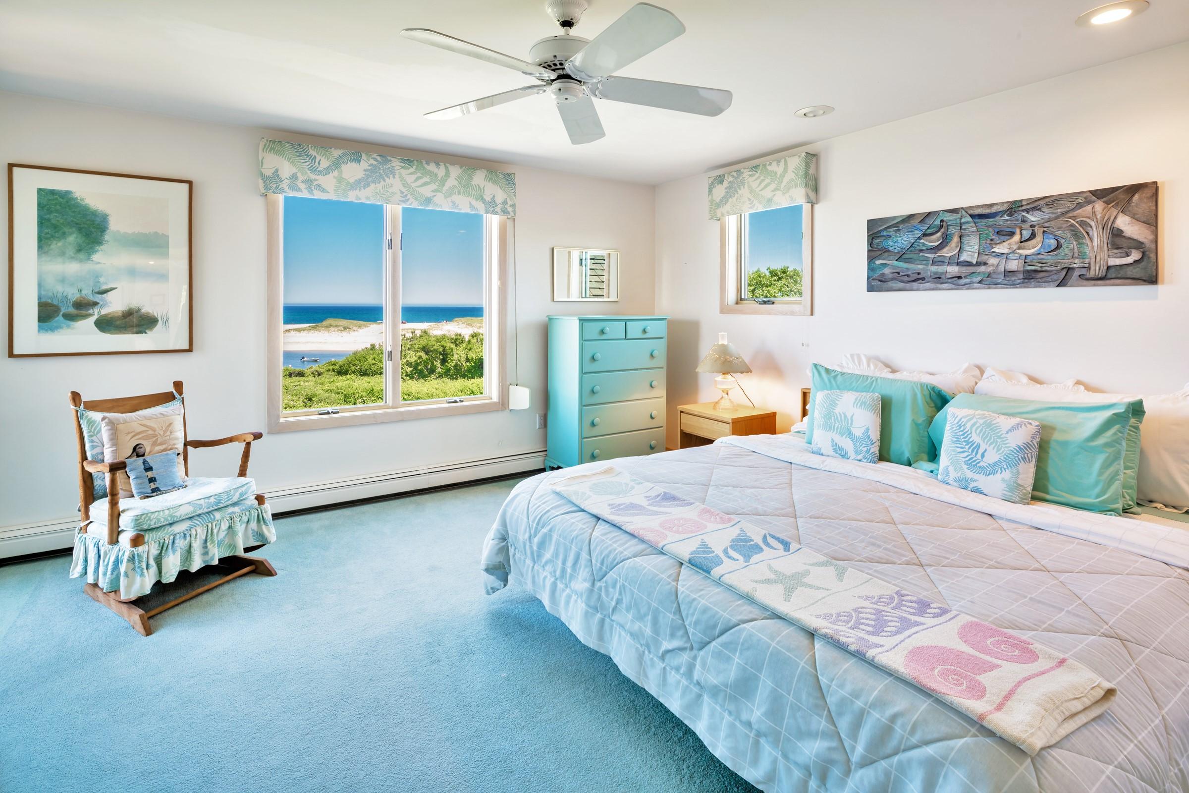 2-7 Skunk Bluff Orleans, MA 02653 - Photo 41 of 80 a spacious bedroom with a bed and a window