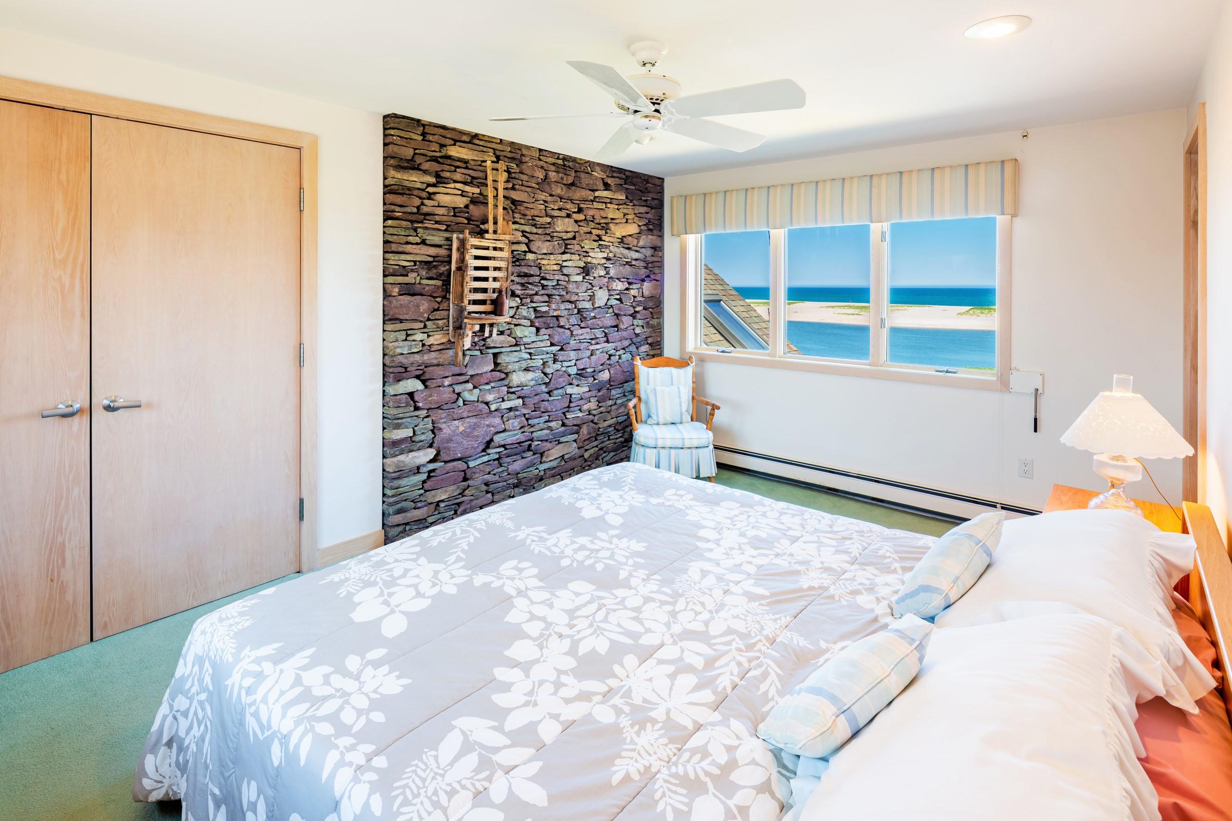 2-7 Skunk Bluff Orleans, MA 02653 - Photo 44 of 80 a bedroom with a bed and a window