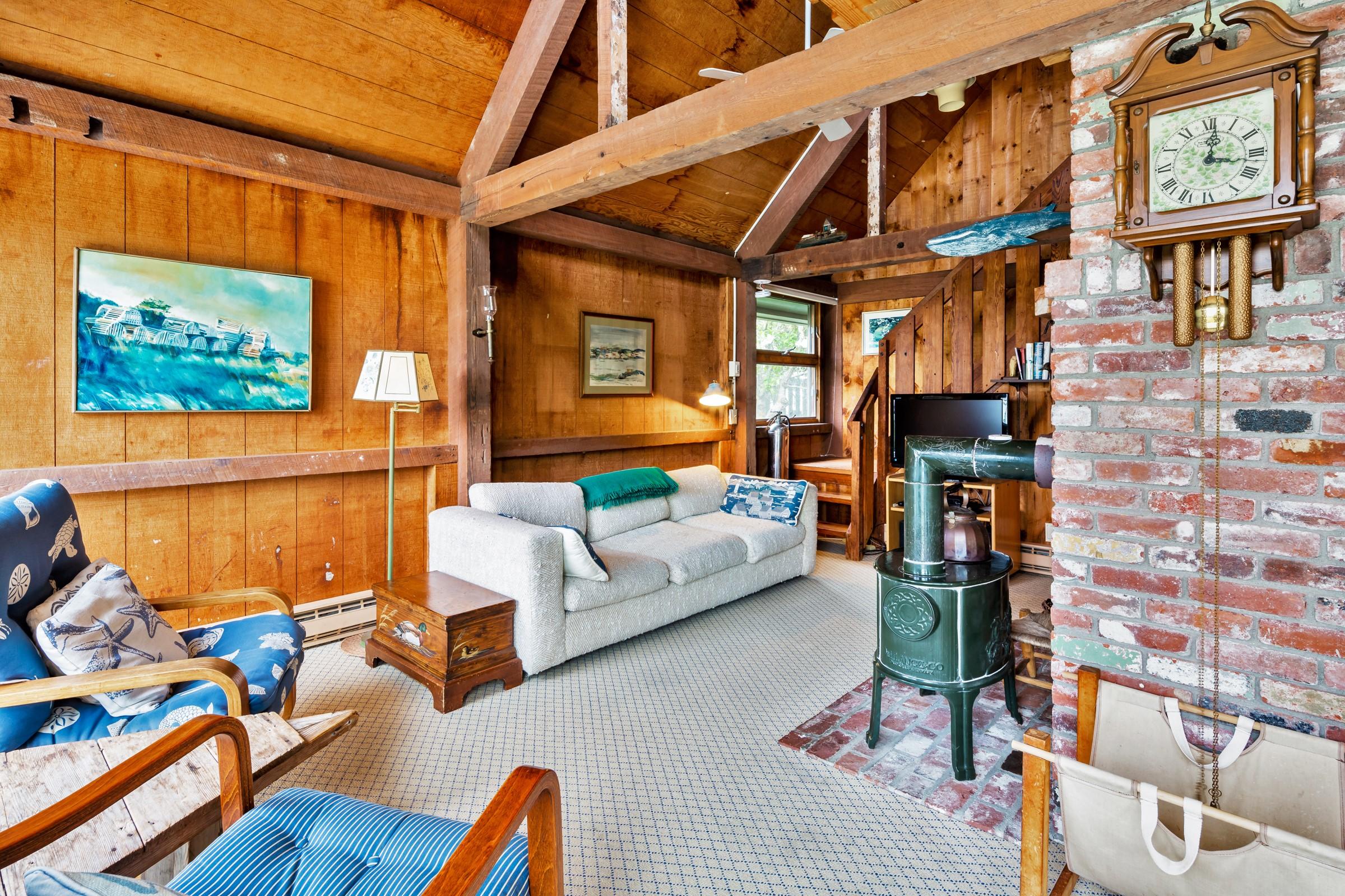 2-7 Skunk Bluff Orleans, MA 02653 - Photo 64 of 80 a living room with furniture a rug and a window