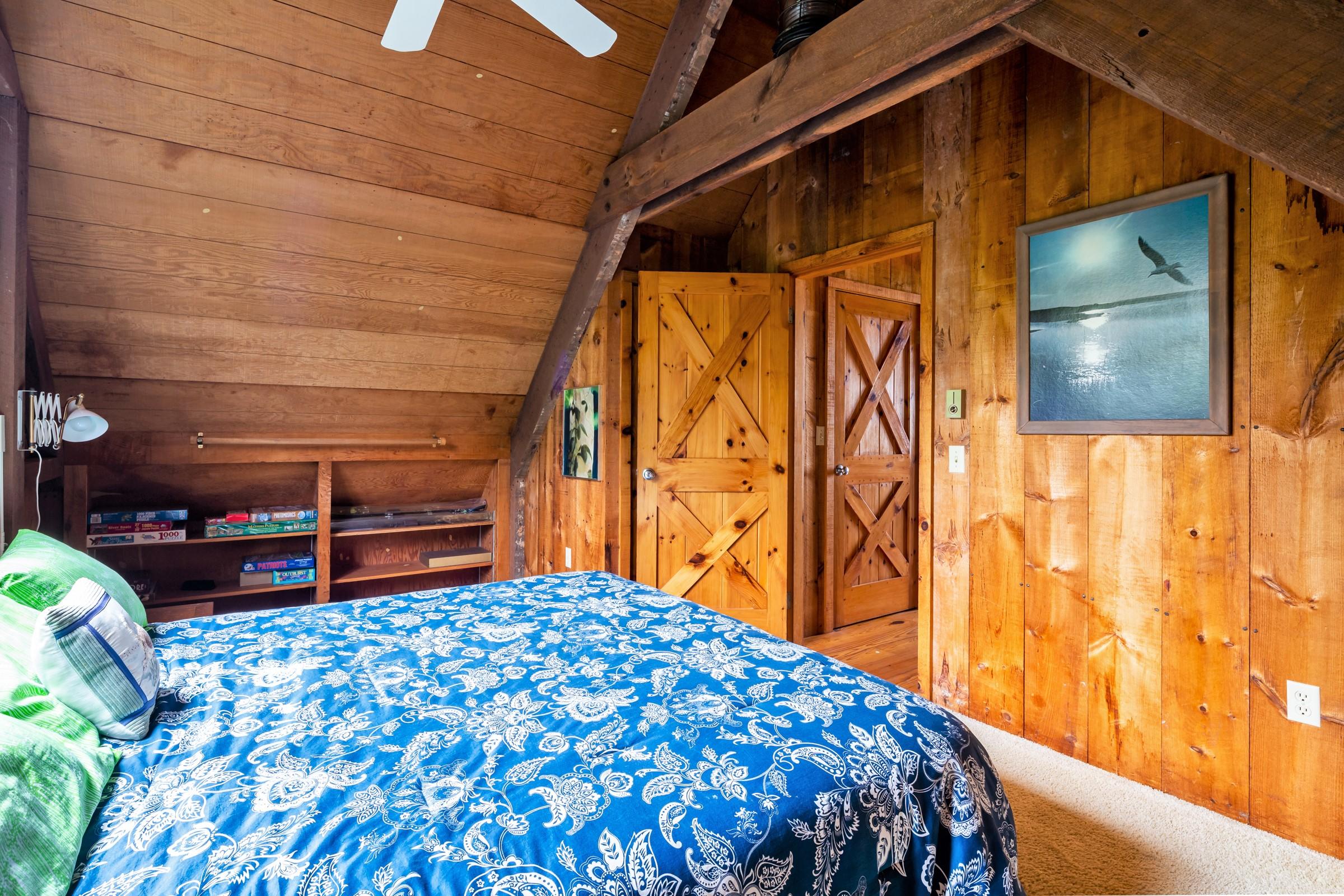 2-7 Skunk Bluff Orleans, MA 02653 - Photo 68 of 80 a bedroom with a bed and a table