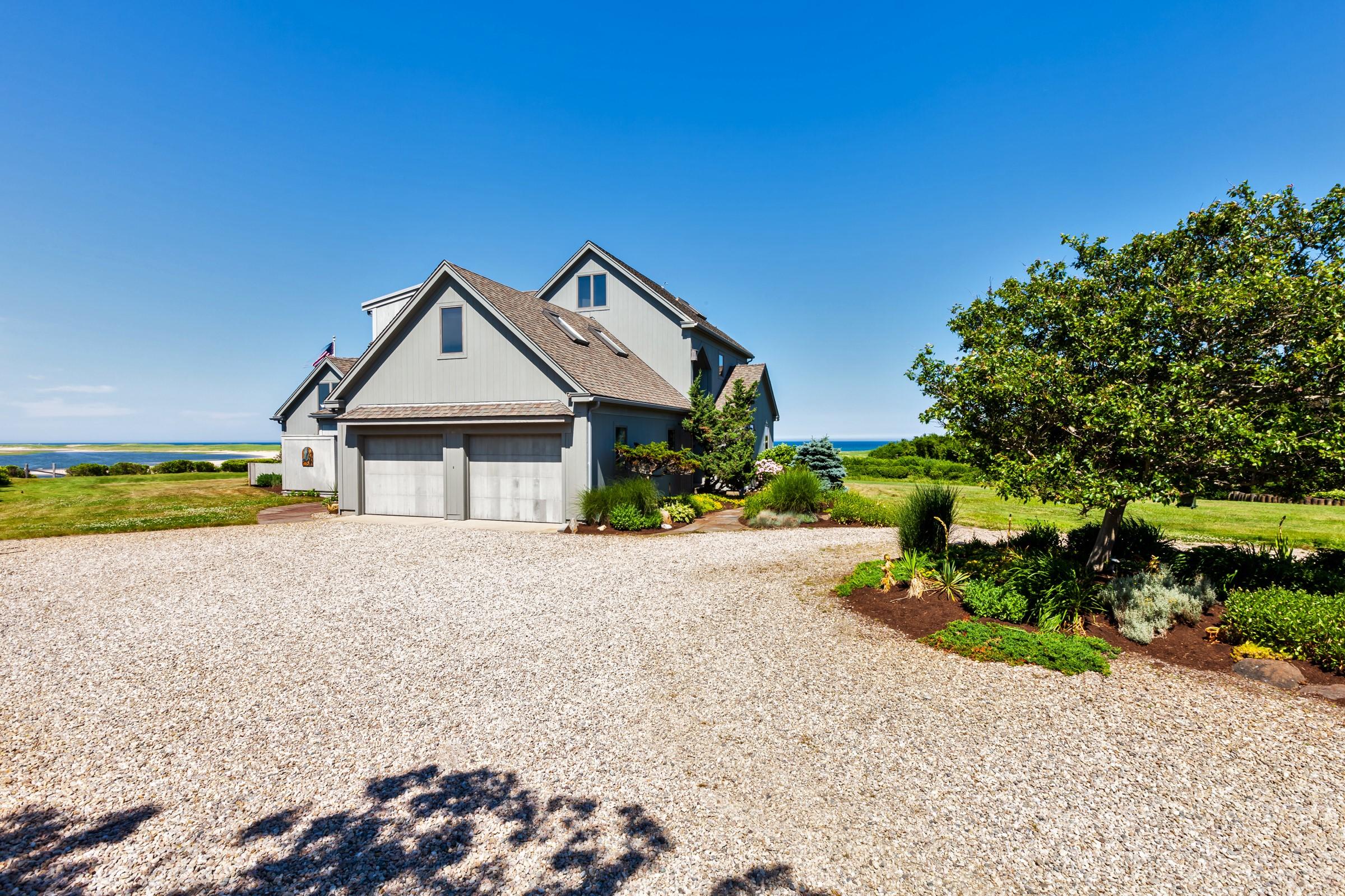 2-7 Skunk Bluff Orleans, MA 02653 - Photo 10 of 80 a view of a house with a yard and large trees