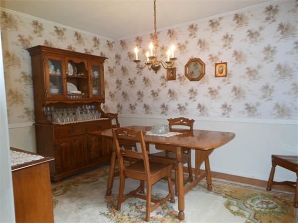 899 Maple Road Longmeadow, MA 01106 - Photo 5 of 10 a view of a dining room with furniture and chandelier