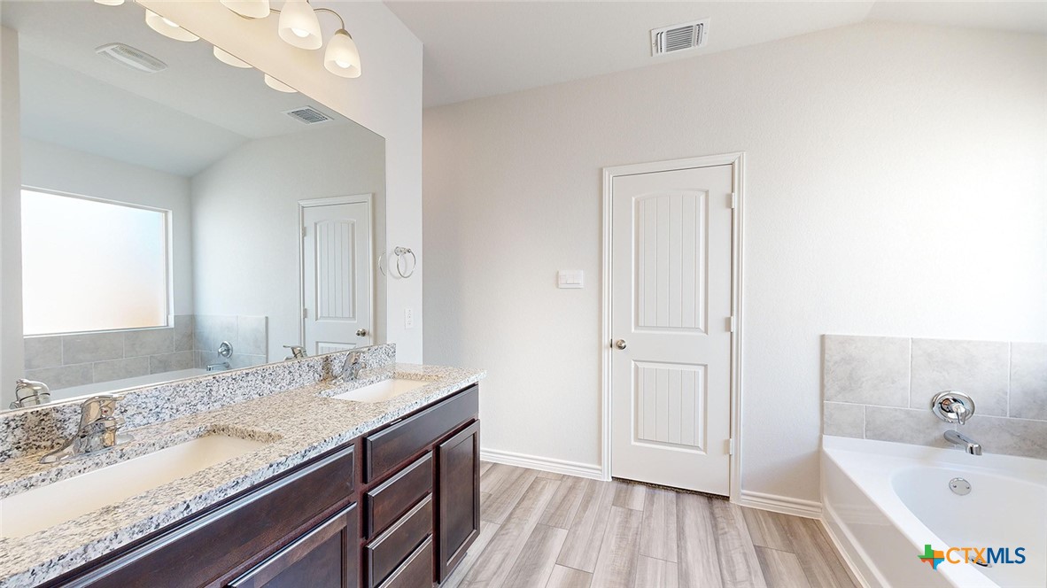 2136 Buckner Street Nolanville, TX 76559 - Photo 20 of 33 a bathroom with a sink and a mirror