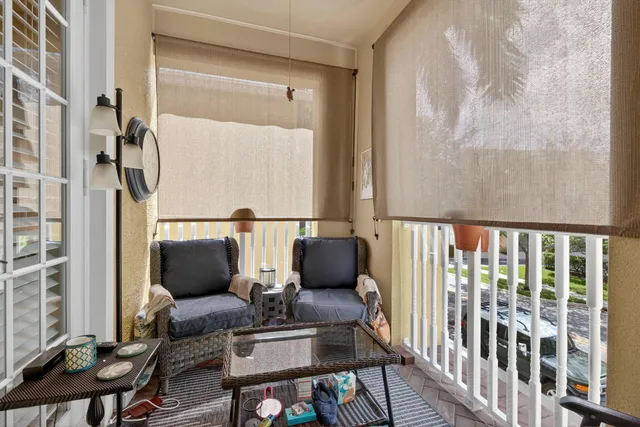 a bedroom with bed and a painting on the wall