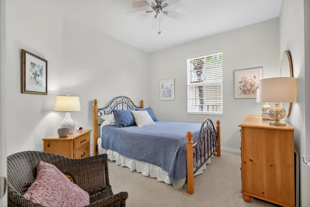 a bedroom with a bed and a table in it