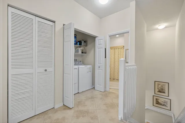 a view of a hallway with closet and entryway