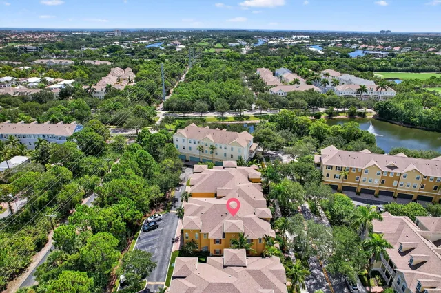 an aerial view of residential house with outdoor space and street view