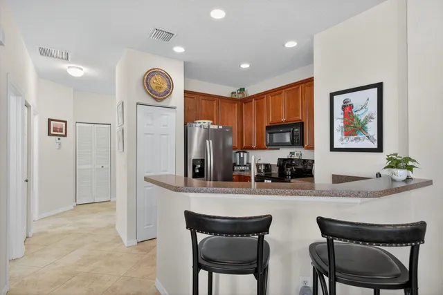 a kitchen with stainless steel appliances granite countertop a stove and a sink