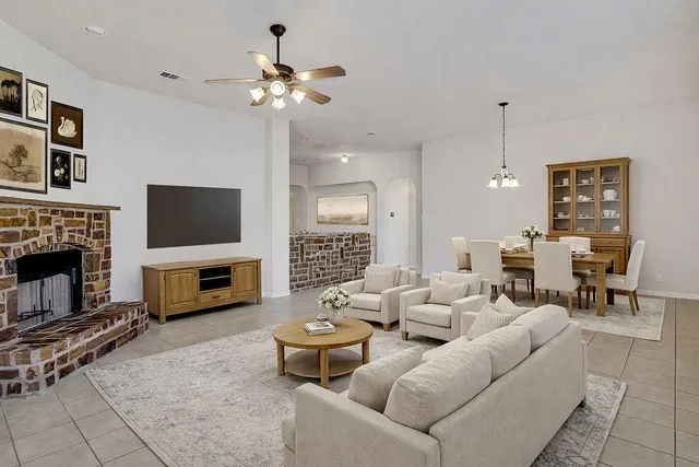 a view of an empty room with a fireplace