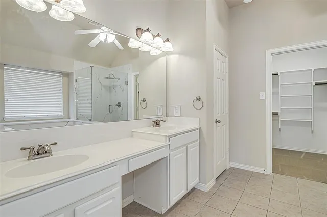a bathroom with a bathtub and shower