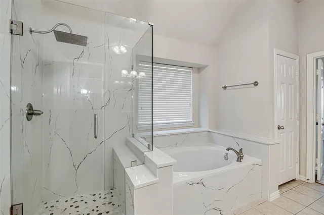 a spacious bathroom with a double vanity sink mirror and shower