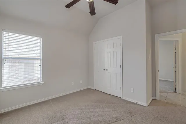 a view of a backyard with a fence