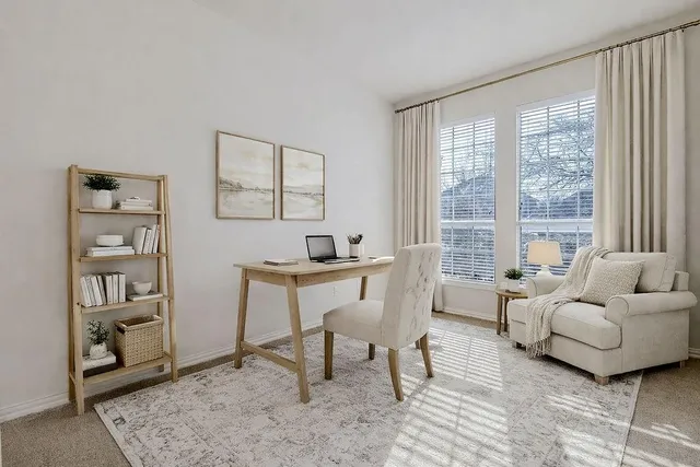 a work room with furniture and a window