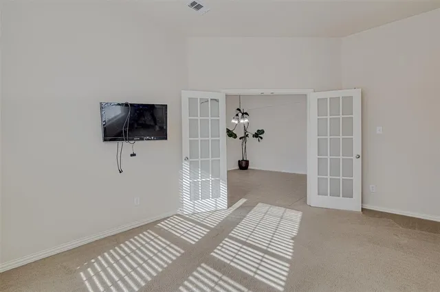 a view of a livingroom with a hardwood and a bedroom