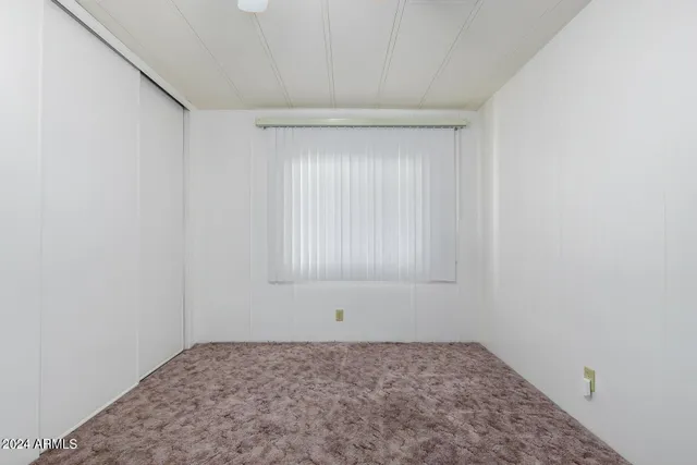 a view of a big room with carpet in it