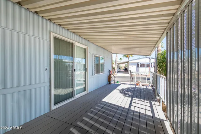 a kitchen with granite countertop white cabinets and stainless steel appliances