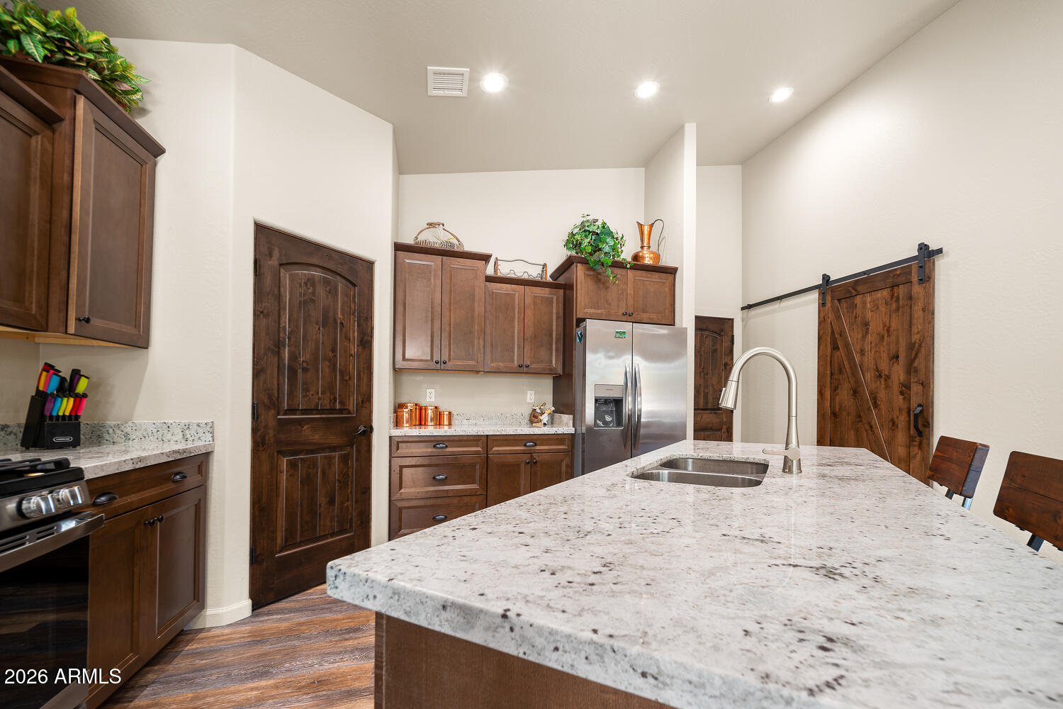 3160 North Eagle Landing Road Show Low, AZ 85901 - Photo 13 of 37 a kitchen with kitchen island granite countertop a refrigerator stove microwave and sink
