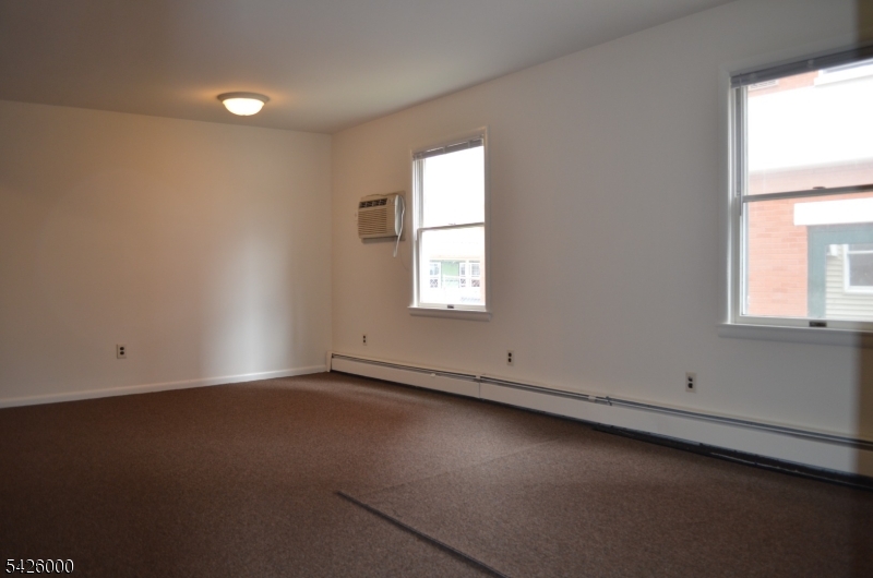 50 Cook Avenue, Unit 1A Madison, NJ 07940 - Photo 2 of 13 an empty room with a window