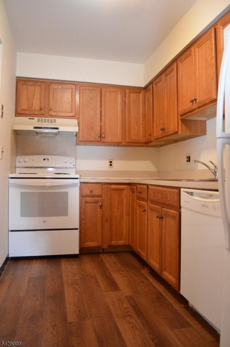 50 Cook Avenue, Unit 1A Madison, NJ 07940 - Photo 5 of 13 a kitchen with a sink and cabinets