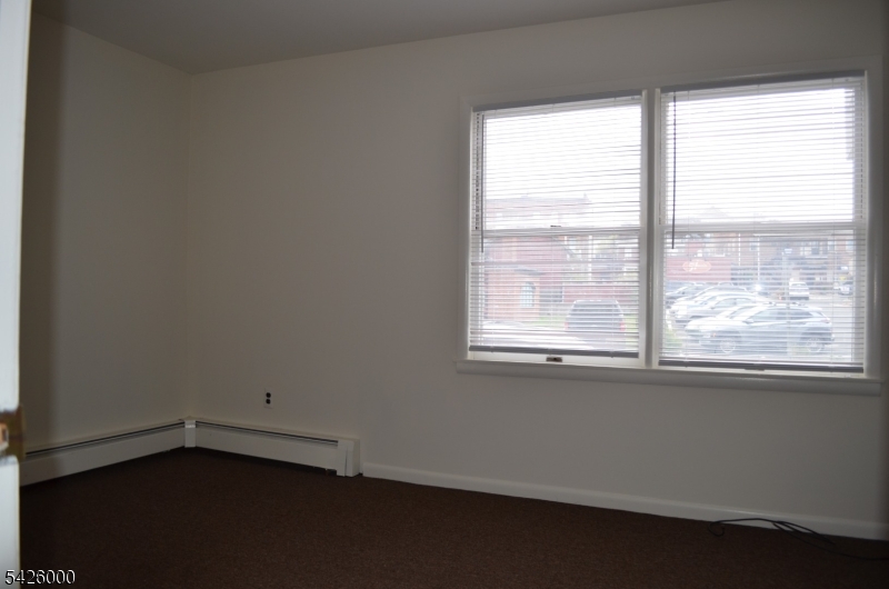 50 Cook Avenue, Unit 1A Madison, NJ 07940 - Photo 6 of 13 an empty room with a window