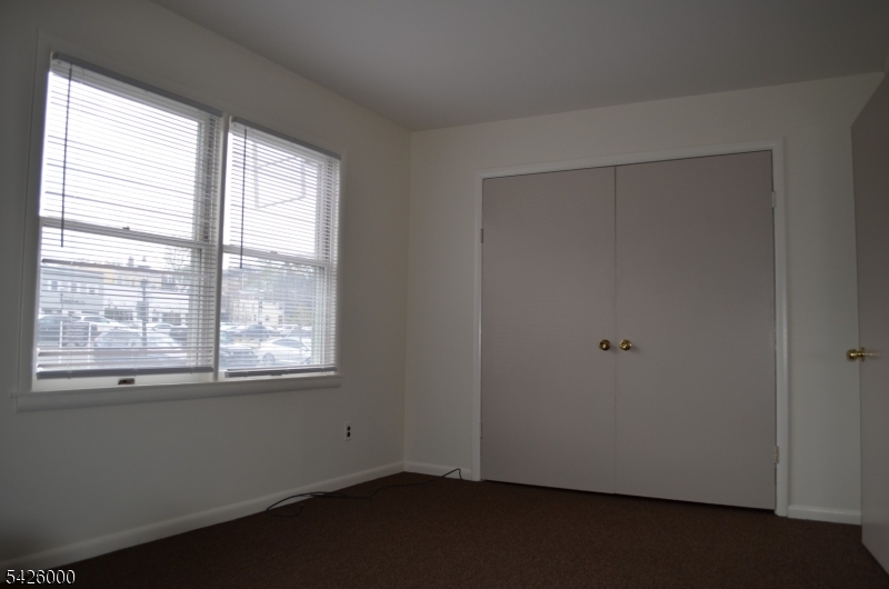 50 Cook Avenue, Unit 1A Madison, NJ 07940 - Photo 7 of 13 an empty room with a window