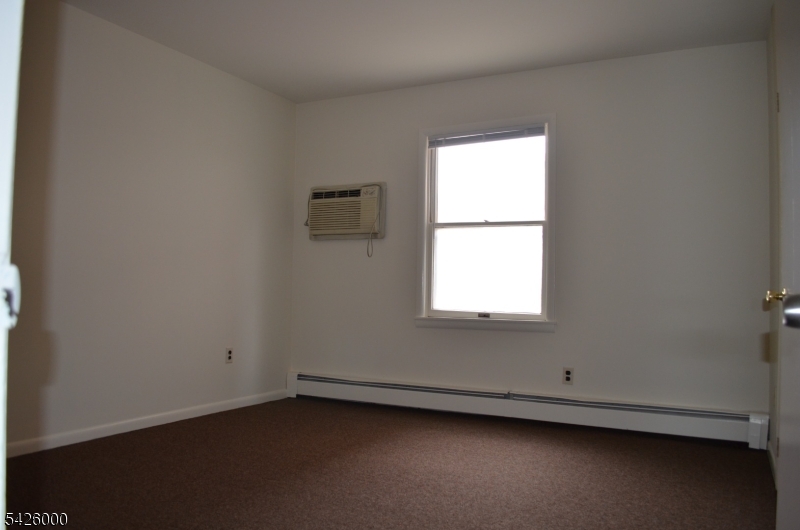 50 Cook Avenue, Unit 1A Madison, NJ 07940 - Photo 9 of 13 an empty room with a window