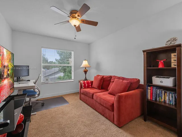 an aerial view of a house with a yard and garden