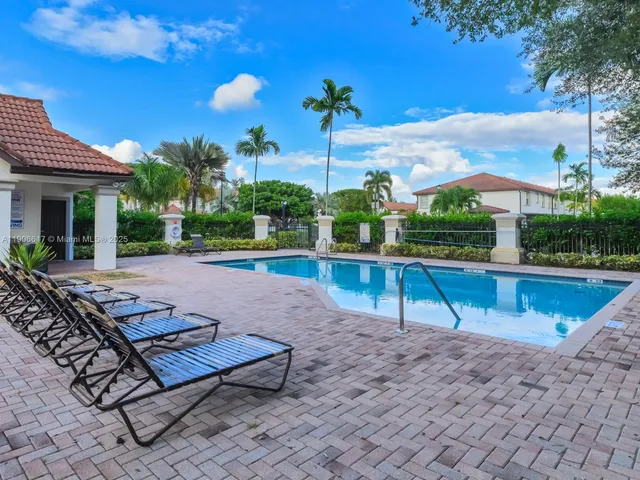 a view of front door and small plants