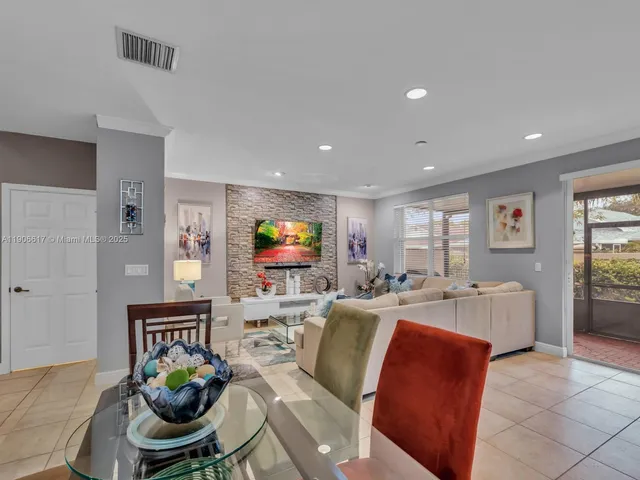 a living room with fireplace furniture and a flat screen tv