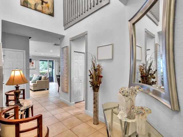 a kitchen with stainless steel appliances granite countertop a refrigerator stove a sink and dishwasher